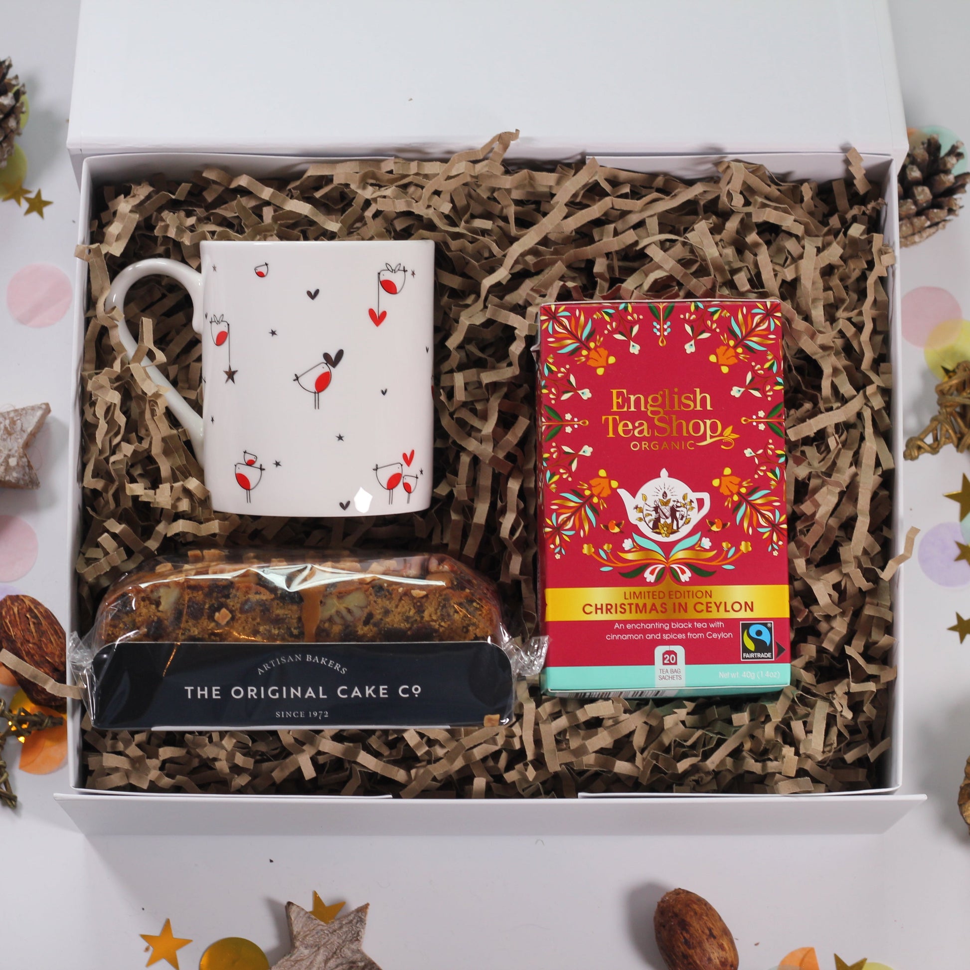 Hug gift box set with robin mug, Christmas tea, and a festive mini cake.