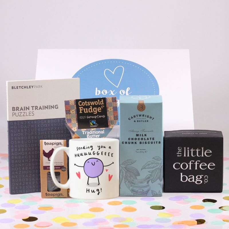 Gift box with a hug mug, tea bags,fudge, brain train puzzles, chocolate chunk biscuits and coffee.