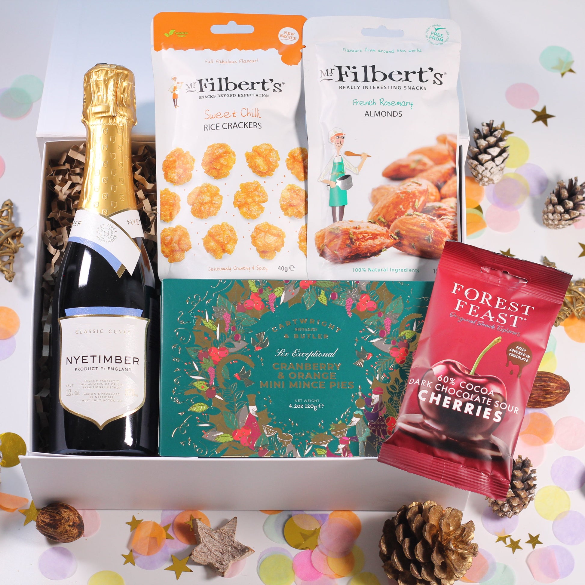 Christmas Gift box with English Sparkling Wine champagne, cranberry and orange mince pies, bag of forest feast chocolate cherries, rice crackers and French rosemary almonds.