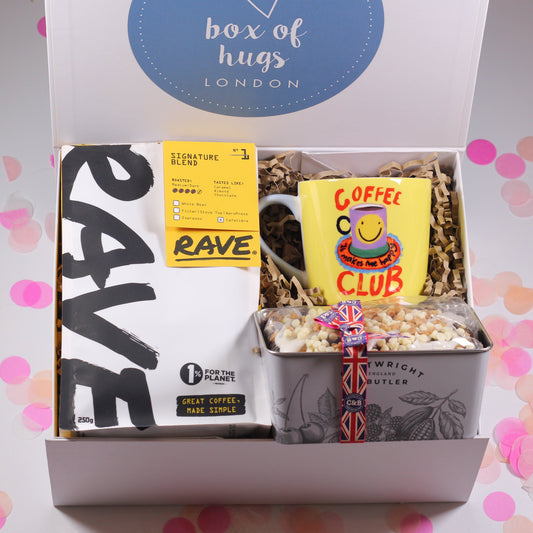 Gift box from 'Box of Hugs London' with coffee, tea, and a mug.