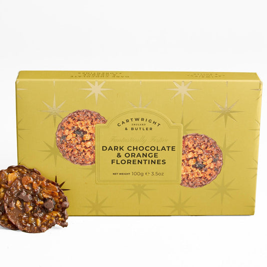 A box of Cartwright & Butles Dark Chocolate & Orange Florentines cookies, shown in a mustard yellow package with two cookies displayed in front on a white background.