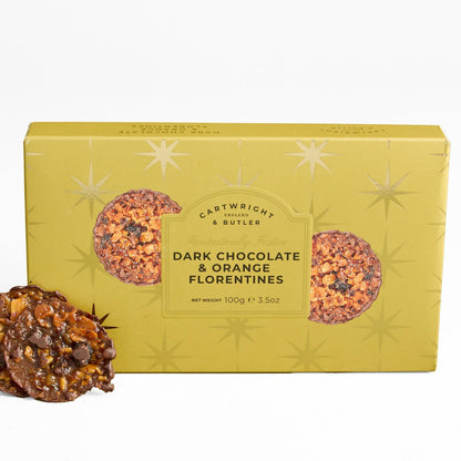A box of Cartwright & Butles Dark Chocolate & Orange Florentines cookies, shown in a mustard yellow package with two cookies displayed in front on a white background.