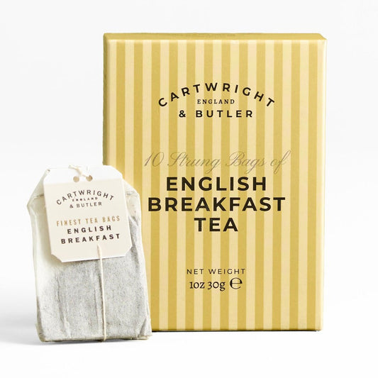 A box of Cartwright & Butler English Breakfast Tea next to a single tea bag on a clean white background.