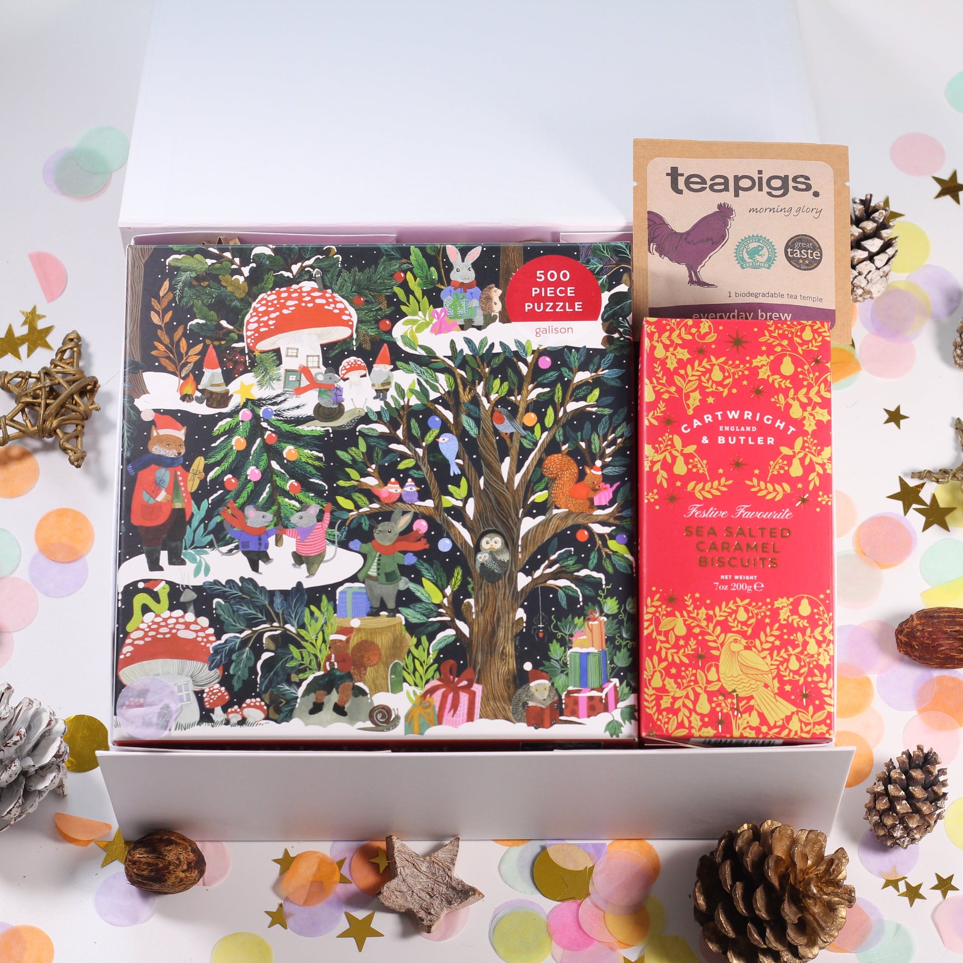 Christmas gift box with Christmas Jigsaw puzzle, sea salted caramel biscuits and tea.