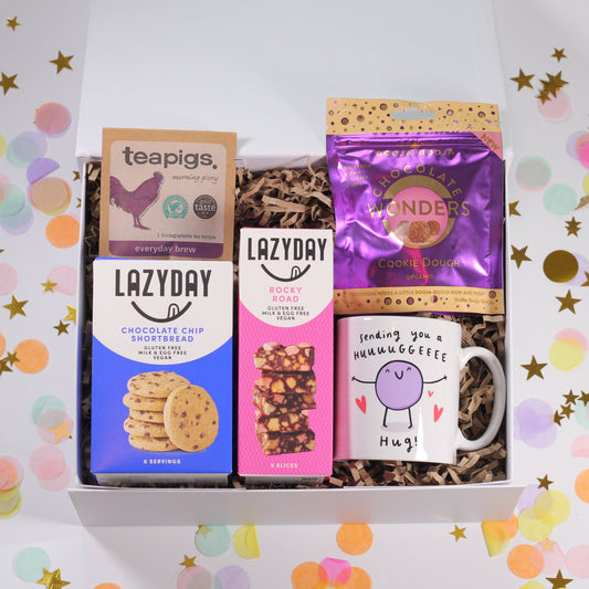 Gift box with vegan and gluten free snacks, tea and a hug mug.