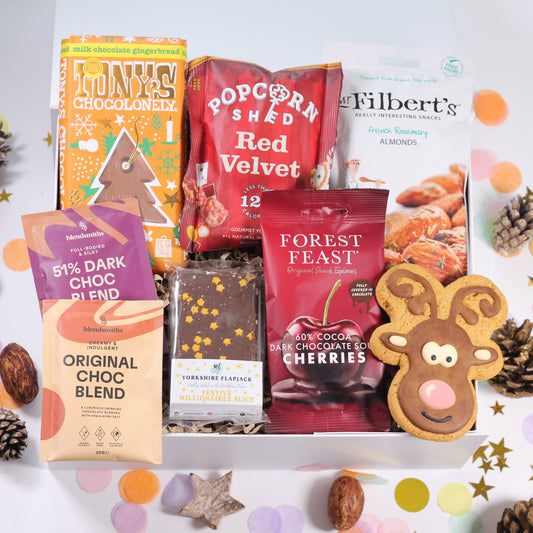 Christmas gift hamper with festive treats, hot chocolate, french rosemary almonds, gingerbread chocolate, festive flapjack and popcorn.