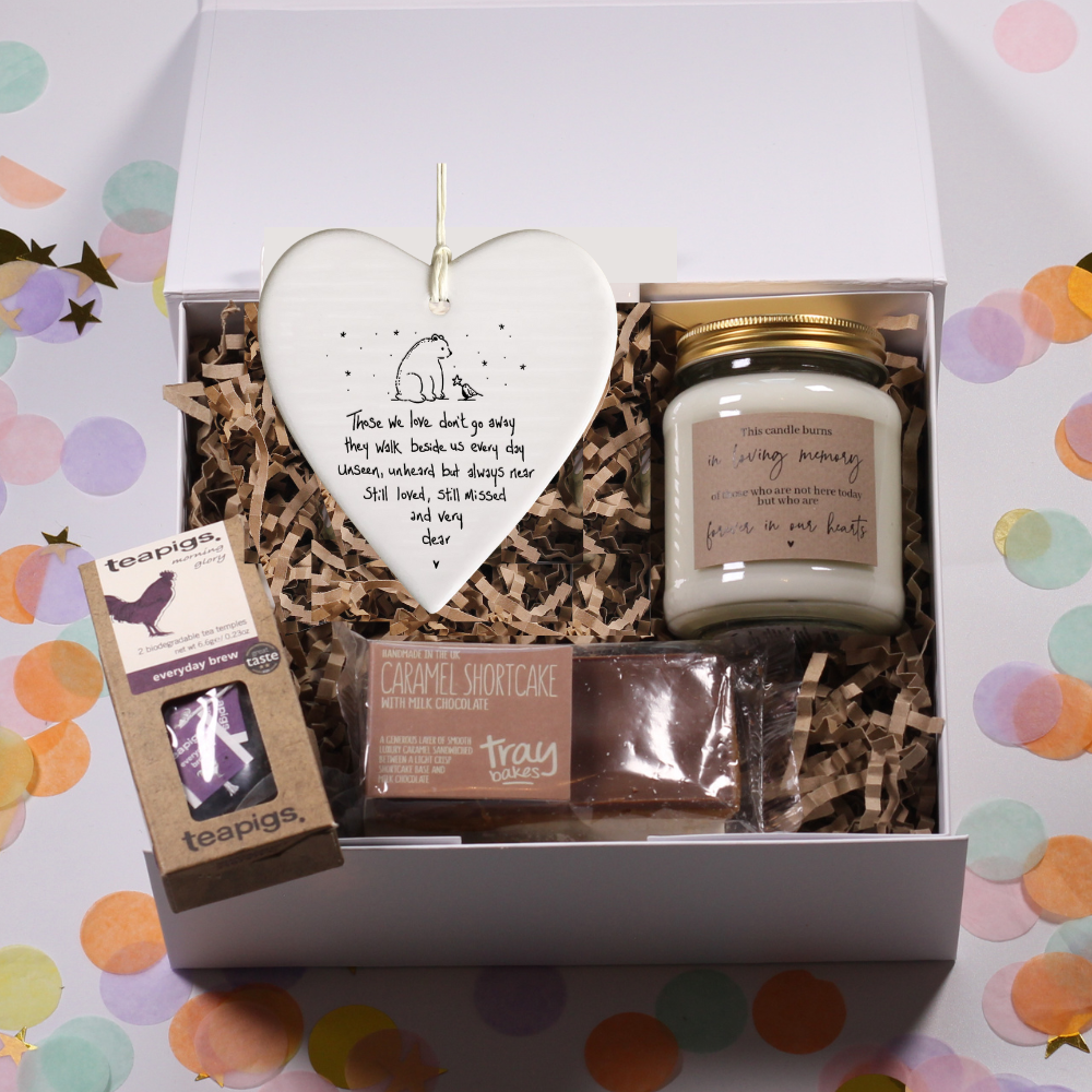 Gift box with a loving memory candle, tea, bereavement hanging sign, and chocolate caramel shortcake.