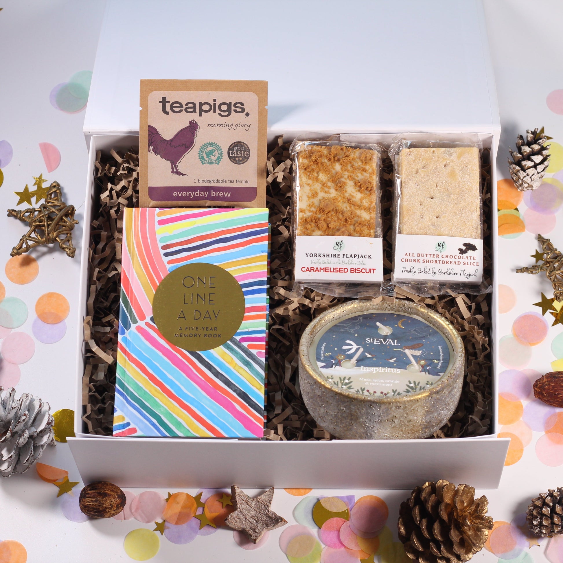 Gift box with yorkshire biscoff flapjack, shortbread, a colourful 'one line a day' journal, and a beautiful st eval candle and tea.
