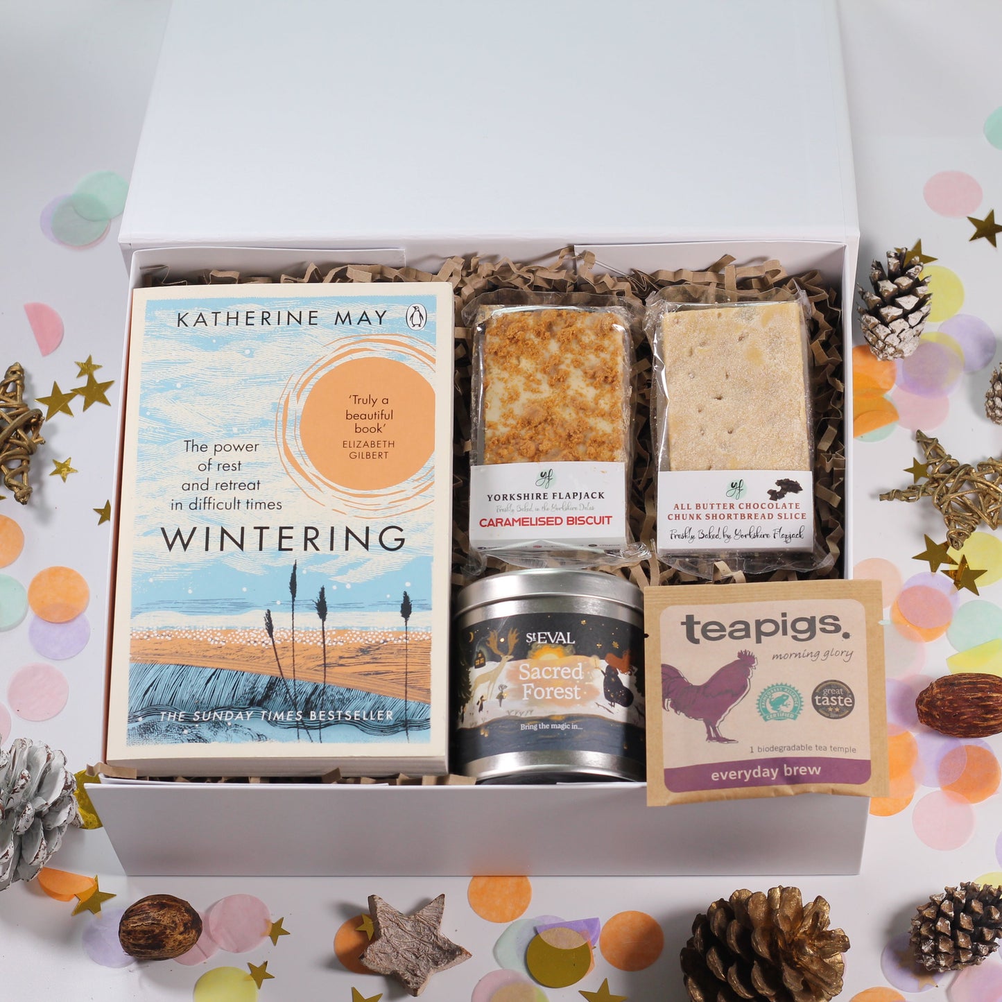 Gift box with 'Wintering' book, sweet snacks, St Eval sacred forest candle and tea. 