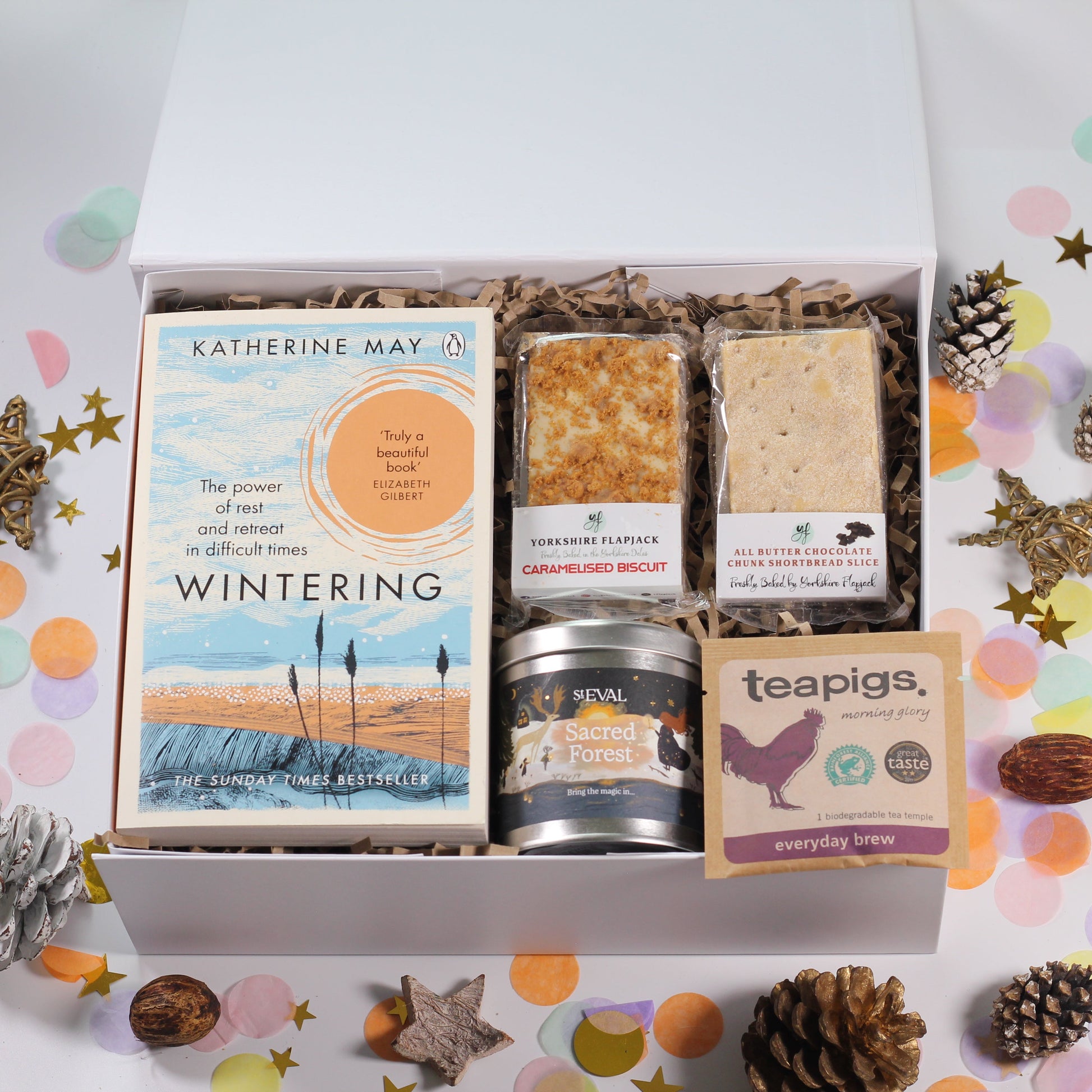 Gift box with 'Wintering' book, sweet snacks, St Eval sacred forest candle and tea. 