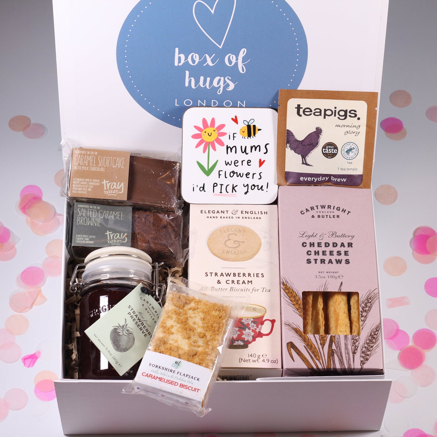 Gift box with various items including chocolate, cookies, and tea, branded 'Box of Hugs London'.