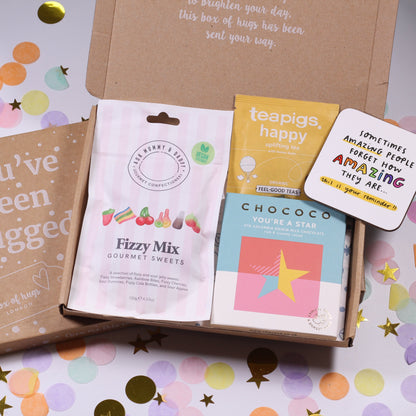 A Box of Hugs letterbox gift with you're a star chocolate, fizzy mix gourmet sweets, uplifting coaster and happy tea.