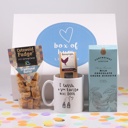 A gift box set with a hug mug, tea, fudge, chocolate chunk biscuits.
