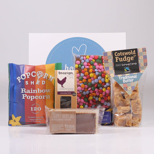 Gift box with popcorn, caramel shortcake, chocolate and fudge.